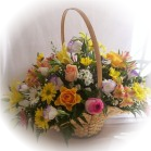 Send a woven basket containing an arrangement of seasonal fresh cut flowers - Click to enlarge