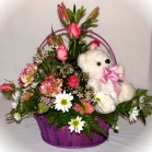 Send an arrangement of quality roses and lilies with a small teddy from a Cape Town florist
