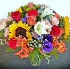 Sending a mixture of quality seasonal fresh cut flowers in a glass vase - Click to enlarge